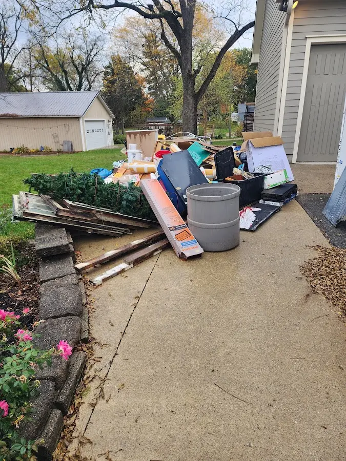 Dumpster being loaded with debris for Demolition Dumpster Rental in Port Orchard